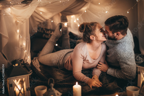 Couple on bed together in romantic mood