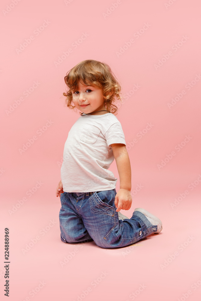 Portrait of happy joyful beautiful little boy, studio shot on pink Portrait of happy joyful beautiful little boy, studio shot on pink