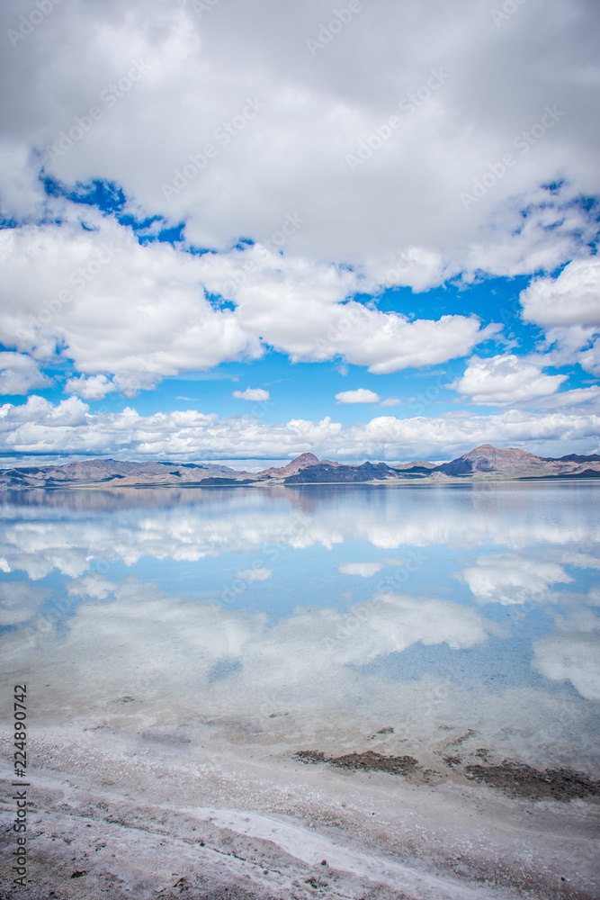 Flooded Bonneville Salt Flats in Utah create a mirror reflection scene on the water