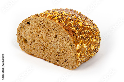 a half dark german bread on white background