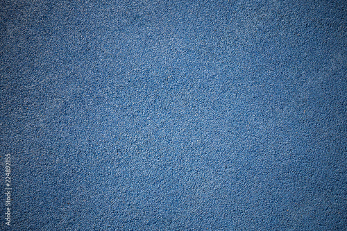 Rubber floor texture. Granules playground cover background.