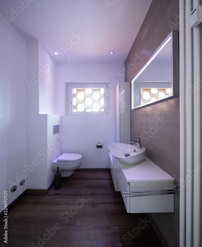 Modern minimal bathroom with parquet