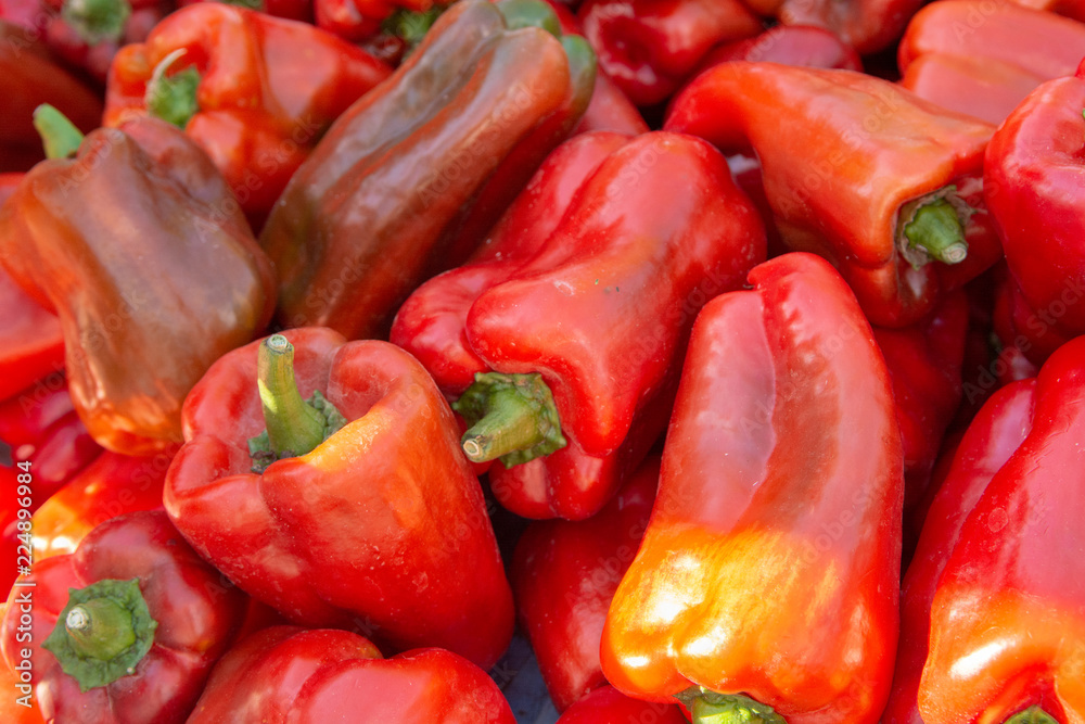Food background with fresh red organic sweet paprika vegetables Food background with fresh red organic sweet paprika vegetables