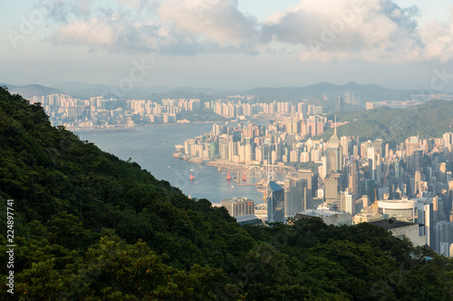 Hong Kong Skyline and Victoria Bay as seen from a natural Viewpoint high above the city