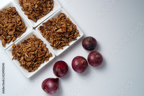 spices fried red onion in bowls on white background