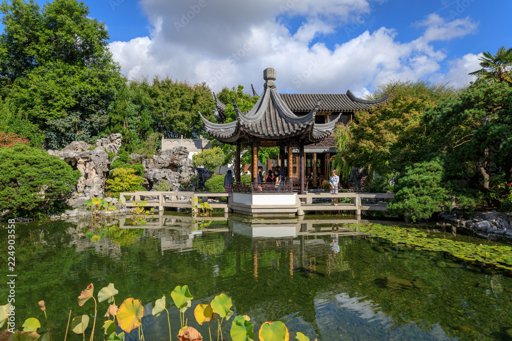 Lan Su Chinese Garden in summer season. Garden Pavilion reflects in pond Lan Su Chinese Garden in summer season. Garden Pavilion reflects in pond