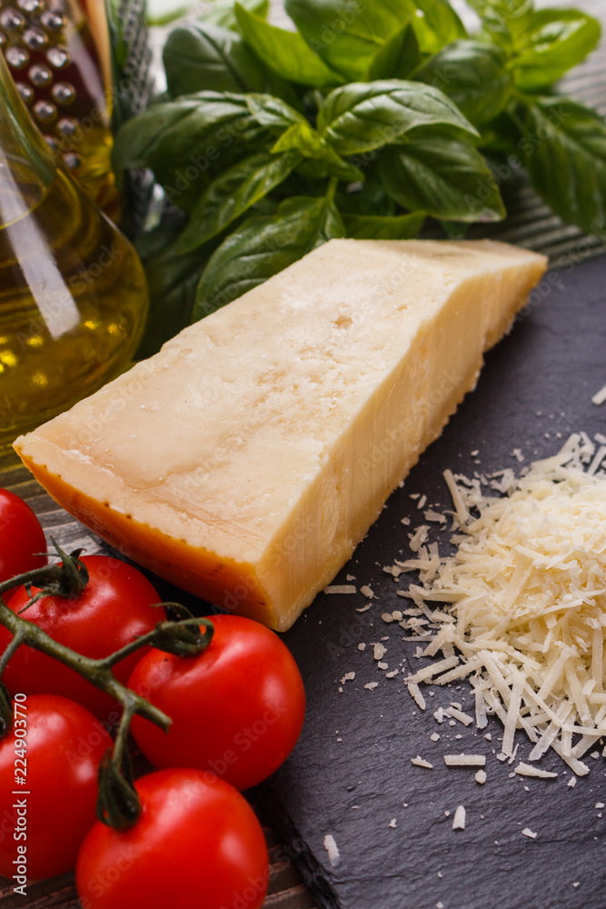 fragrant grated Parmesan on a slate stone slicing board fragrant grated Parmesan on a slate stone slicing board