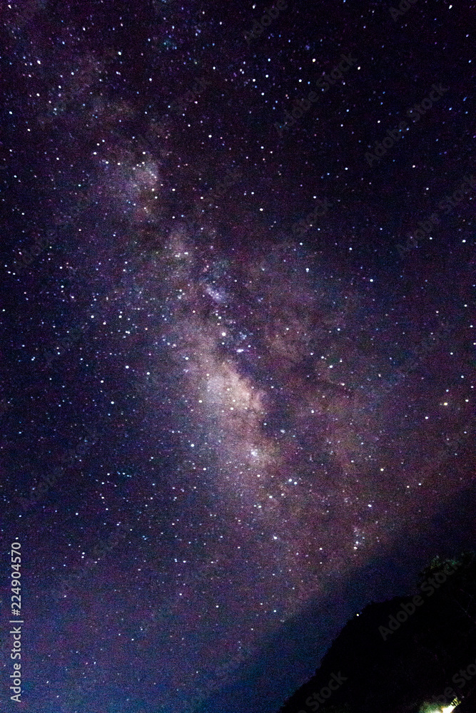 Fototapeta premium stars and the Milky Way on mountain in the beautiful night sky .