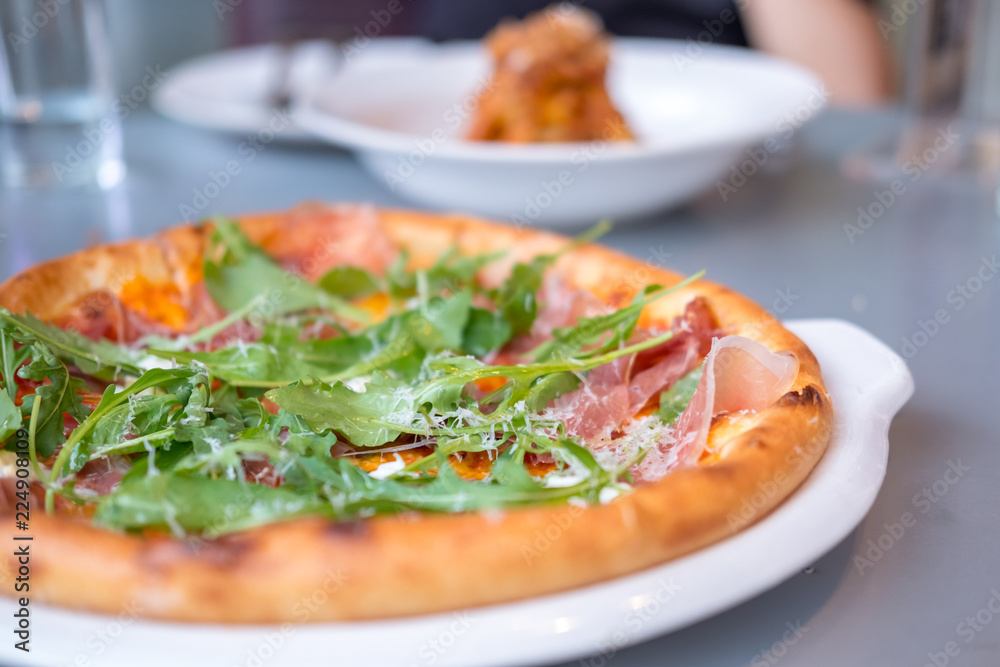 Close up of Parma Ham Pizza on the table.