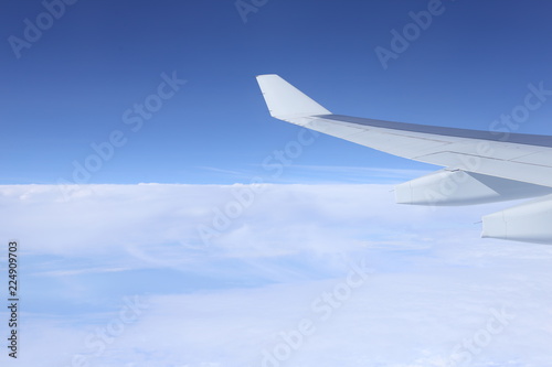  an airplane fly above the clouds