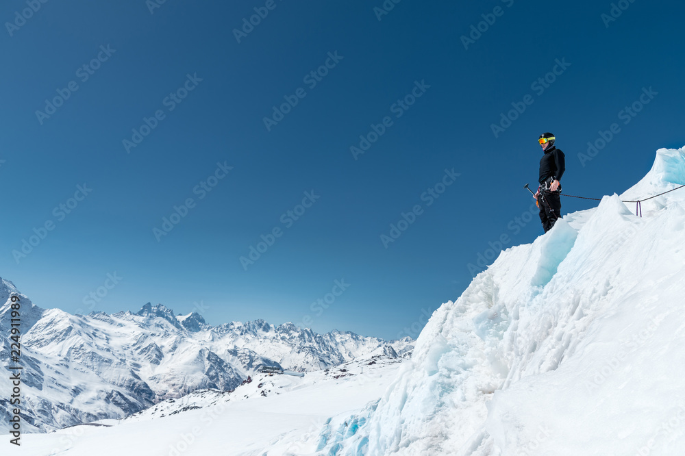 Mountain guide candidate training ice axe and rope skills on a glacier in the North Caucasus