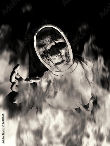 horror devil nun burning like a witch on halloween photo