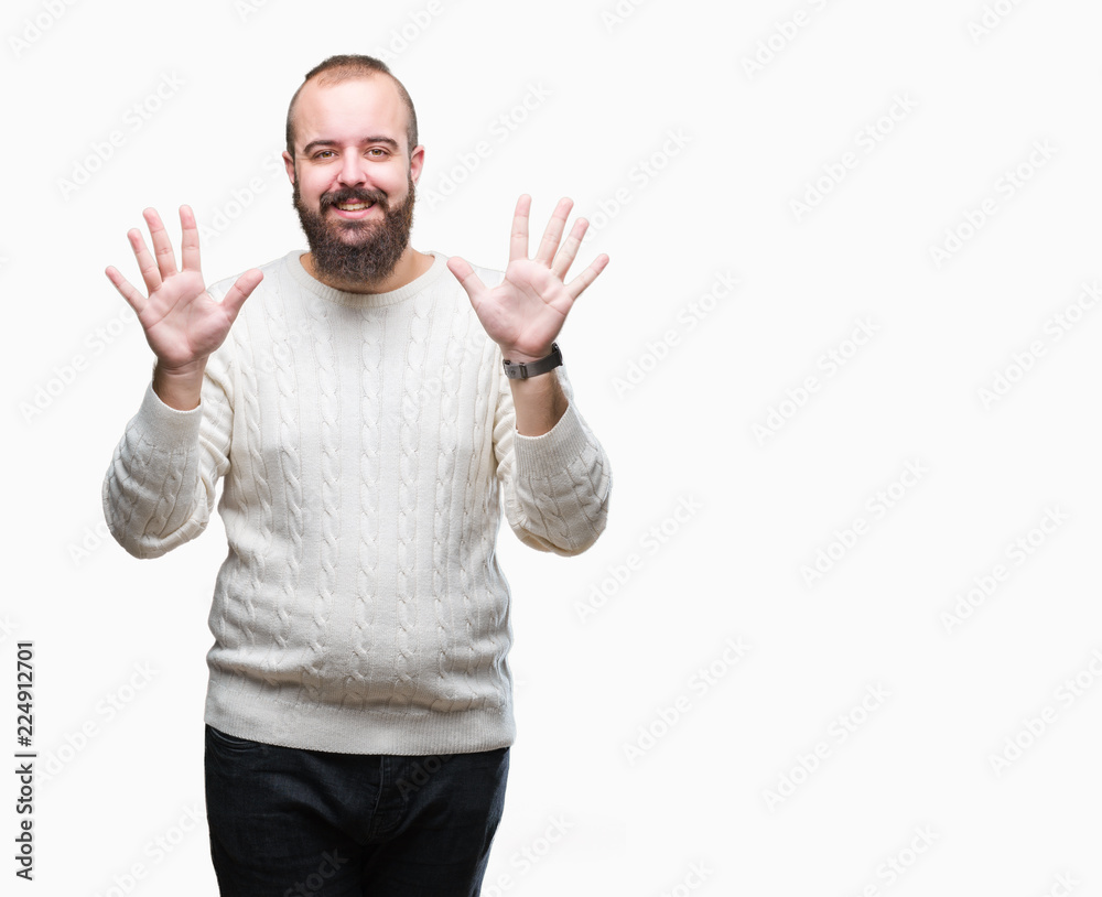 Young caucasian hipster man wearing winter sweater over isolated background showing and pointing up with fingers number ten while smiling confident and happy. Young caucasian hipster man wearing winter sweater over isolated background showing and pointing up with fingers number ten while smiling confident and happy.
