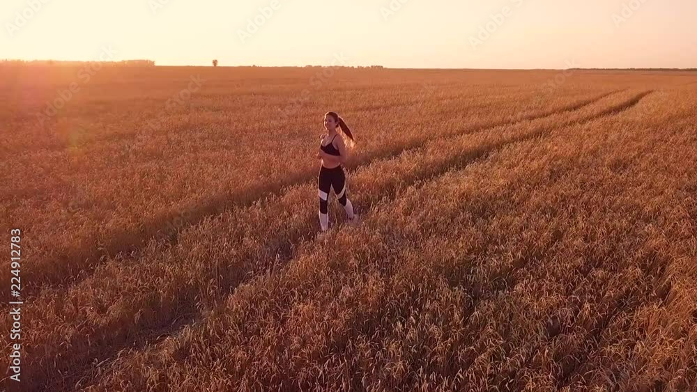 Young girl runner in wheat field Young girl runner in wheat field
