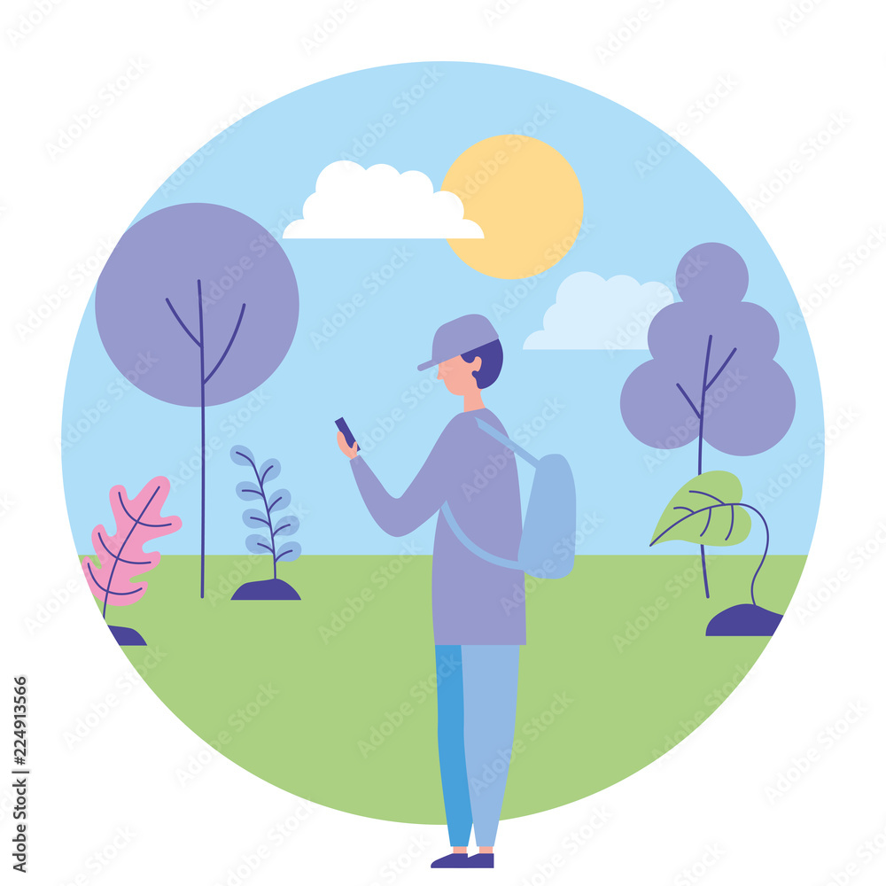 young man using smartphone in the nature landscape