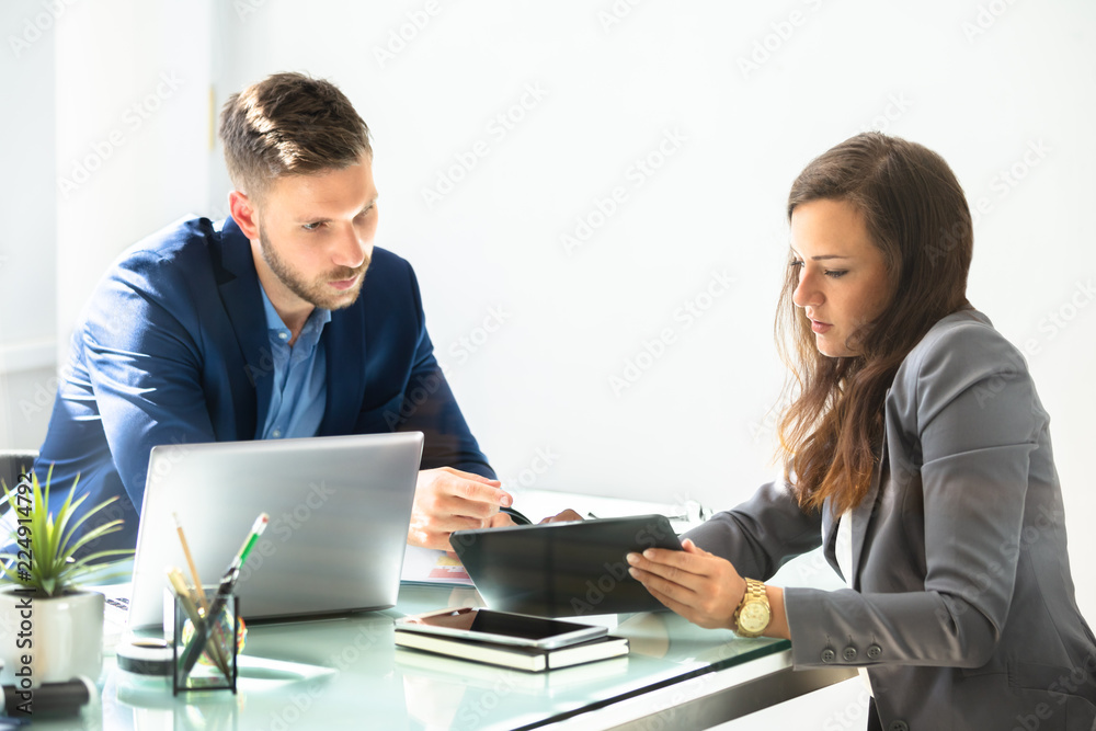 Two Businesspeople Using Digital Tablet Two Businesspeople Using Digital Tablet