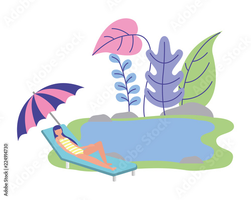 woman sunbed with umbrella in the lake relaxing
