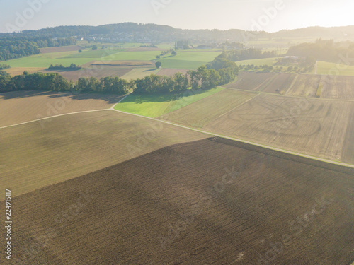 Aerial view of plowed fields in rural landscape in Switzerland