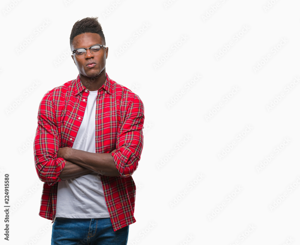 Fototapeta premium Young african american man over isolated background skeptic and nervous, disapproving expression on face with crossed arms. Negative person.