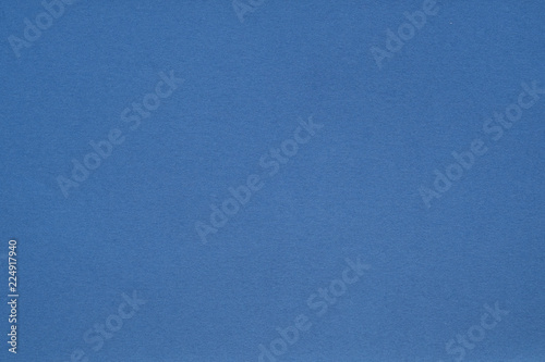 jeans blue paper texture background. colored cardboard fibers and grain. empty space concept.