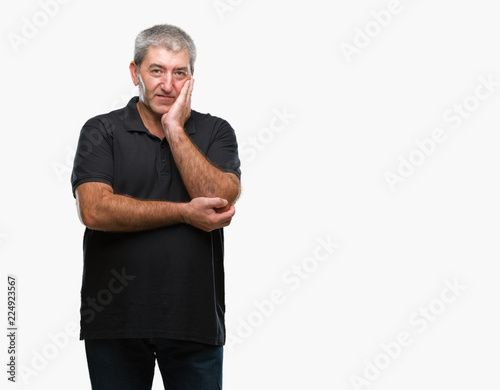 Handsome senior man over isolated background thinking looking tired and bored with depression problems with crossed arms.