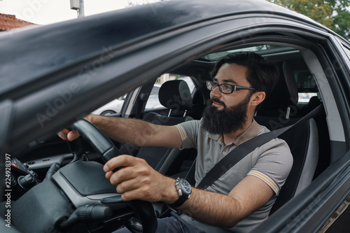 Modern casual bearded man driving a car © arthurhidden