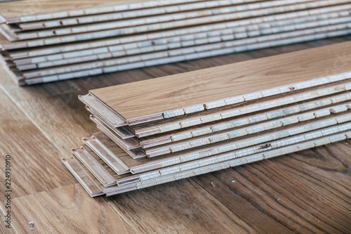 Laminated wooden flooring boards arranged
