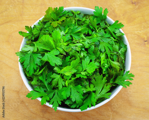Fresh parsley on wooden table