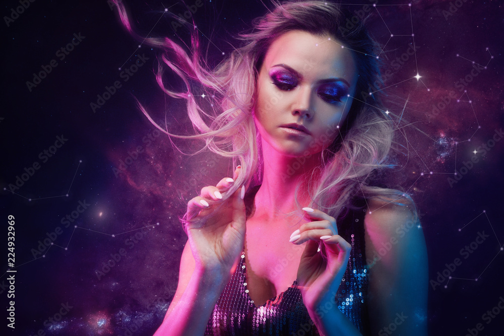 Portrait of a young beautiful woman on the background of stars. Portrait of a young beautiful woman on the background of stars.