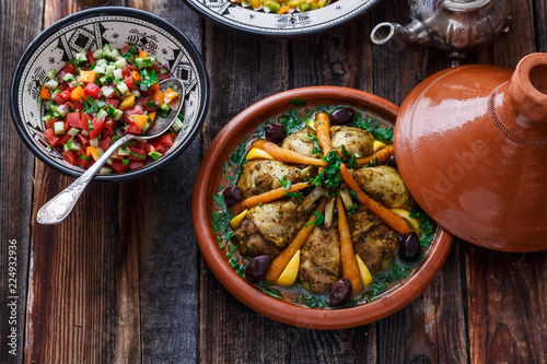 Fototapeta Naklejka Na Ścianę i Meble -  Slow cooked chicken with carrots, morrocan tajine, rustic style