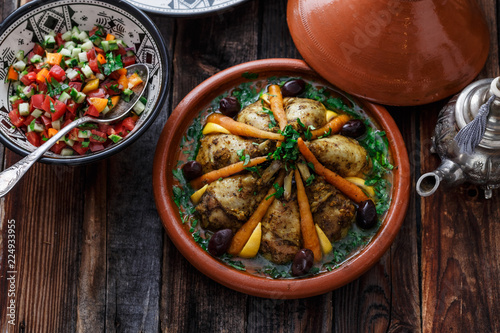 Chicken tajine with couscous, moroccan food, close view.