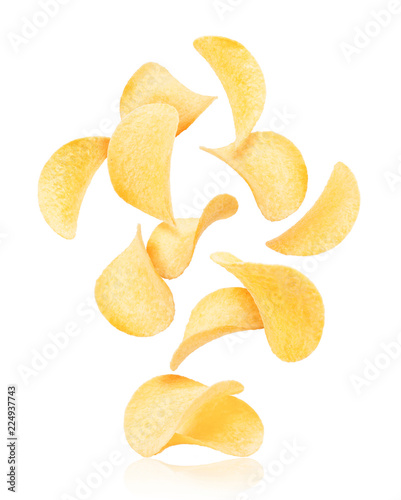 Potato chips rise up from the pile with chips, isolated on a white background photo