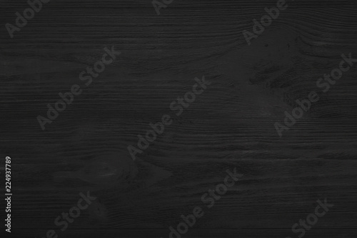 Upper, top view of a black wooden blackboard background in old, rustic style