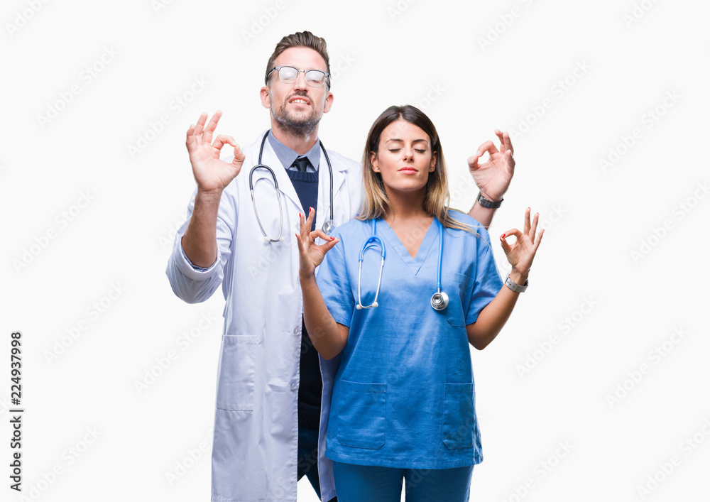 Young couple of doctor and surgeon over isolated background relax and smiling with eyes closed doing meditation gesture with fingers. Yoga concept. Young couple of doctor and surgeon over isolated background relax and smiling with eyes closed doing meditation gesture with fingers. Yoga concept.