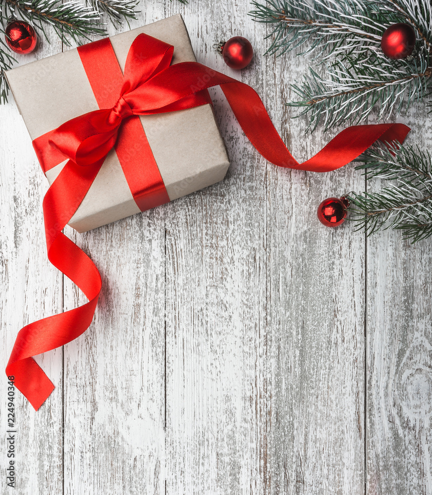 custom made wallpaper toronto digitalChristmas theme with fir branches, cones, present boxes and ribbon globes, on white wooden background viewed from above, in snow, greeting card with space for text