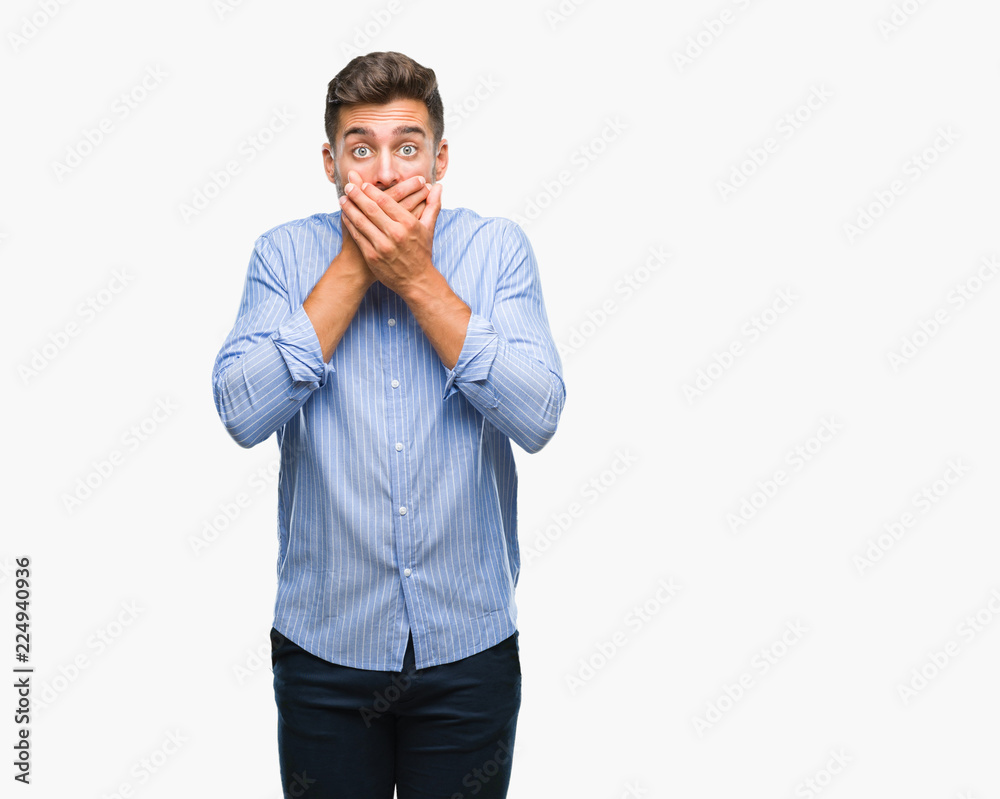 Young handsome man over isolated background shocked covering mouth with hands for mistake. Secret concept. Young handsome man over isolated background shocked covering mouth with hands for mistake. Secret concept.