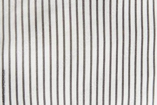  light linen fabric in a fine and wide black strip used for tablecloths, drapes. light coarse coarse linen cloth in a wide black strip used for tablecloths, bedspreads and carpets