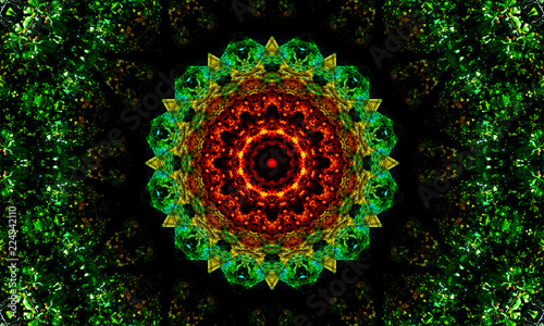 Dark mandala with green shapes and a detailed orange pattern as a core.