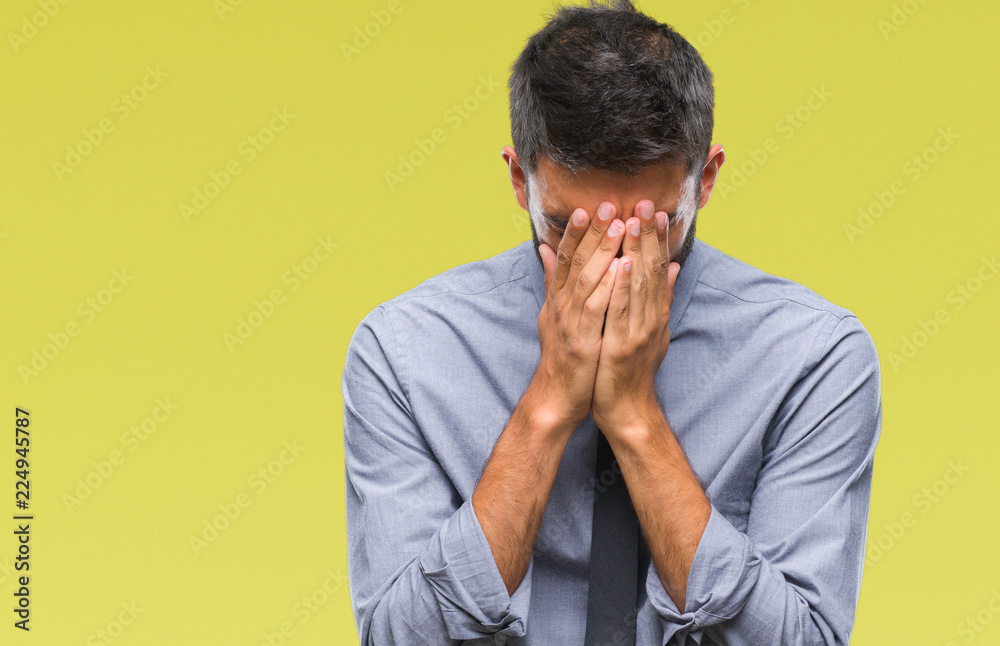 Adult hispanic business man over isolated background with sad expression covering face with hands while crying. Depression concept. Adult hispanic business man over isolated background with sad expression covering face with hands while crying. Depression concept.