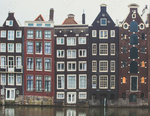 Photography Summer view of the Dancing Canal Houses of Damrak' , iconic canal houses in the