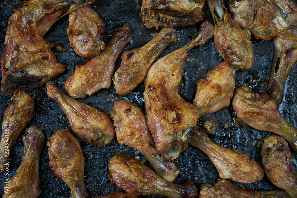 Grilled chicken drumsticks background, top view, close-up. Roasted chicken legs, Cooked with sauce Grilled chicken drumsticks background, top view, close-up. Roasted chicken legs, Cooked with sauce