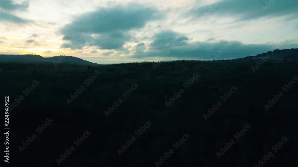 Scenery of sunrise and green fields from the window of a passenger train Scenery of sunrise and green fields from the window of a passenger train