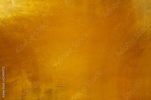 Abstract grunge surface orange bronze gold background golden yellow highlights