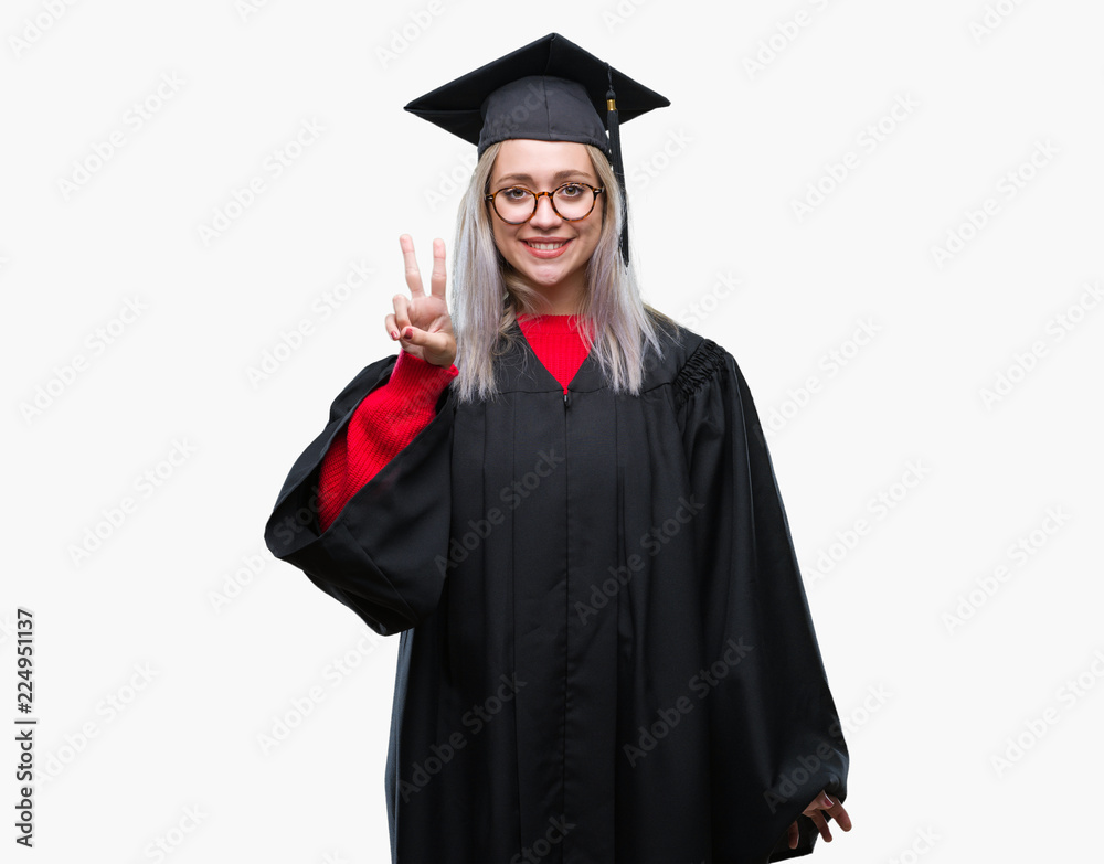 Young blonde woman wearing graduate uniform over isolated background showing and pointing up with fingers number two while smiling confident and happy. Young blonde woman wearing graduate uniform over isolated background showing and pointing up with fingers number two while smiling confident and happy.