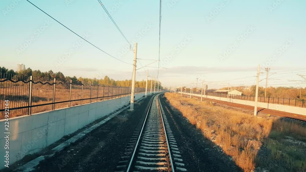 Train approaching to the station in Eskisehir in a beautiful sunny morning, view from the rear of train Train approaching to the station in Eskisehir in a beautiful sunny morning, view from the rear of train