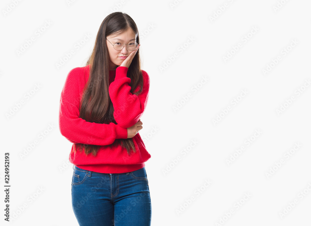 Young Chinese woman over isolated background wearing glasses thinking looking tired and bored with depression problems with crossed arms. Young Chinese woman over isolated background wearing glasses thinking looking tired and bored with depression problems with crossed arms.