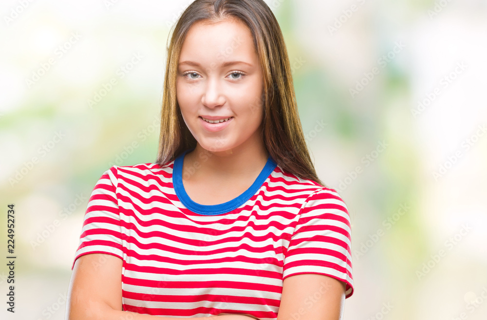 Young caucasian beautiful woman over isolated background happy face smiling with crossed arms looking at the camera. Positive person.
