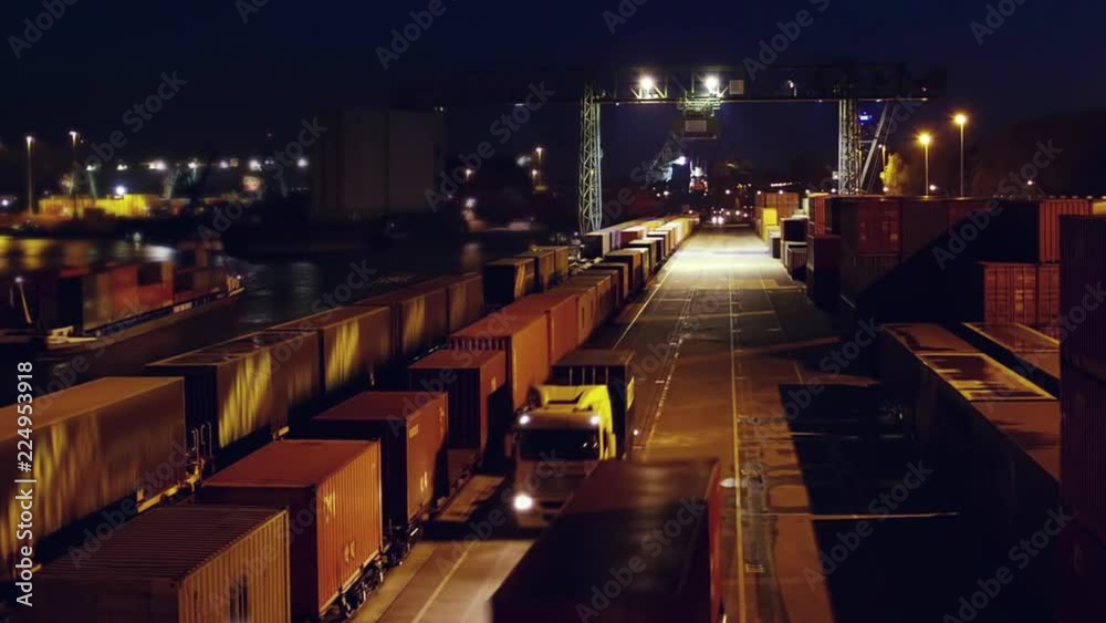 Container load on truck - timelapse - shot at night. just in time logistics Container load on truck - timelapse - shot at night. just in time logistics