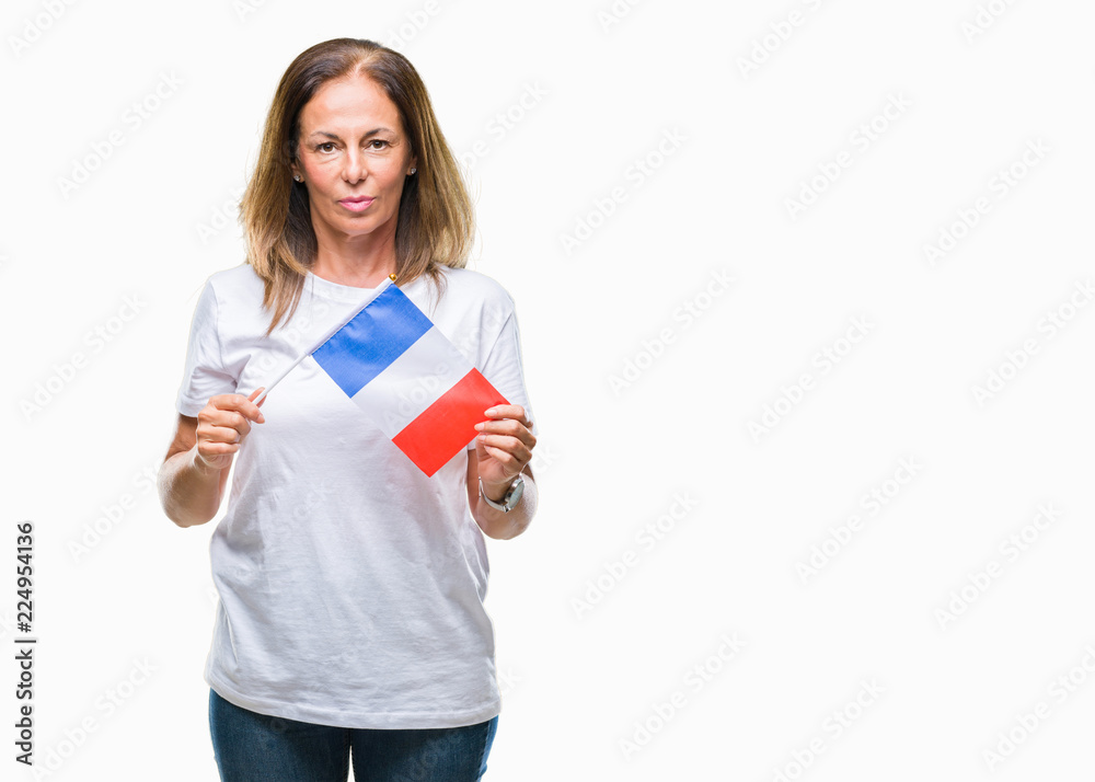 Middle age hispanic woman holding flag of France over isolated background with a confident expression on smart face thinking serious Middle age hispanic woman holding flag of France over isolated background with a confident expression on smart face thinking serious