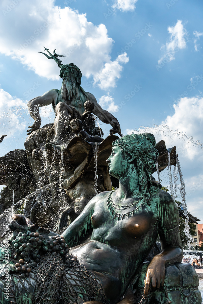 The Neptune Fountain in Berlin, or Neptunbrunnen, designed by Reinhold Begas. Located between the St Mary's Church and the Rotes Rathaus, behind Alexanderplatz. The Neptune Fountain in Berlin, or Neptunbrunnen, designed by Reinhold Begas. Located between the St Mary's Church and the Rotes Rathaus, behind Alexanderplatz.